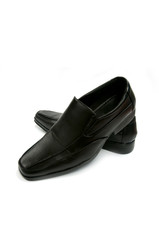 Black glossy man shoe isolated on white background