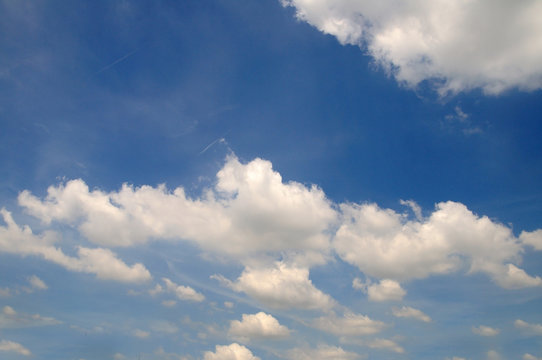 Blue sky with white clouds for background.
