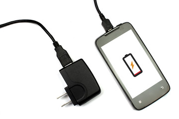 cellphone and charger on white background, isolated