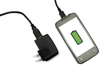 cellphone and charger on white background, isolated