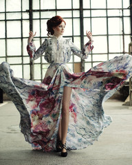 Naklejka premium elegance woman with flying dress in palace room