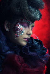 young woman with bright fantasy make up