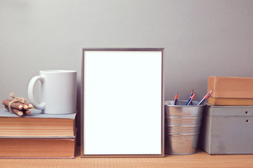 Picture frame mock up template with books and desk objects