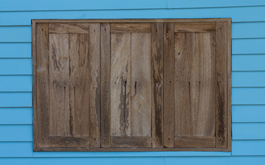 Obraz na płótnie Canvas Old wood window blue wall