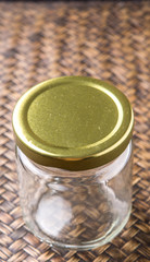 Empty mason jar on wicker background