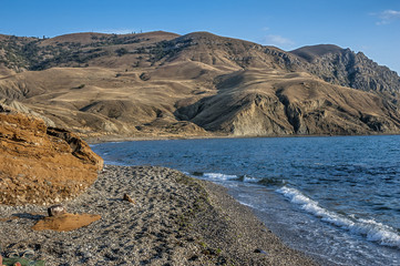 Crimea , tract Alchak - Kai. Pebble beach near Cape Meganom .