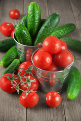 Tomatoes and cucumbers in buckets