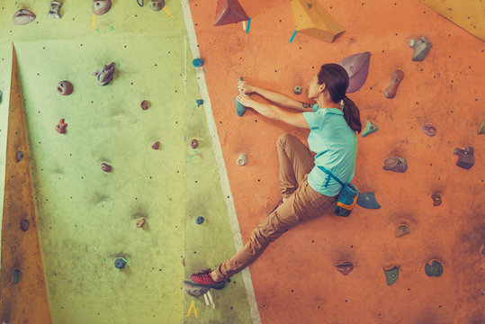 Active girl climbing indoor