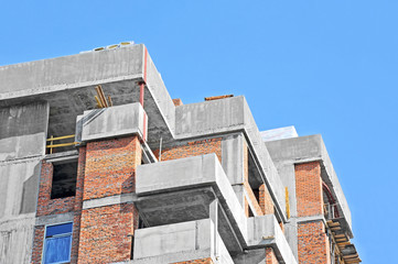 Building construction site work against blue sky