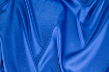 Blue silk cloth texture close up.