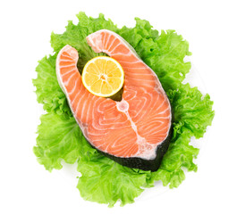 Fresh salmon steak with pepper and lemon.