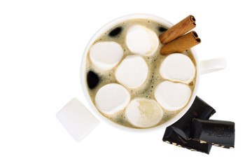 A cup of hot chocolate with marshmallows and chocolate isolated