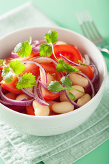 healthy tomato salad with white beans onion coriander