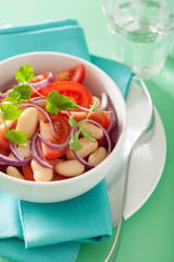 healthy tomato salad with white beans onion coriander