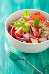 healthy tomato salad with white beans onion coriander