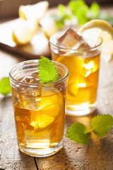glass of ice tea with lemon and melissa