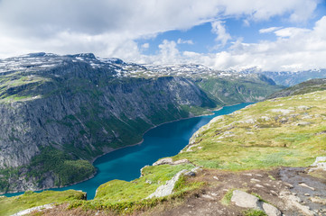 Lake valley and mountain landscape near Trolltunga, Norway