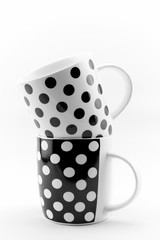 Black and white polka dots mugs isolated on white background