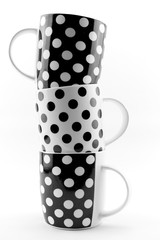 Black and white polka dots mugs isolated on white background