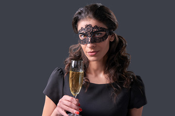 Party woman holding glass with champagne
