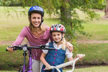 Mother and her daughter on their bike 