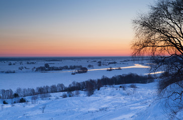 Fototapeta na wymiar Sunrise over the river in winter