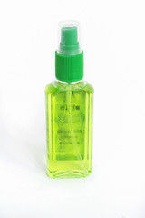 Balsam bottle plastic white backdrop.