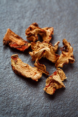 Dried Galangal Root in Close Up on Dark Stone