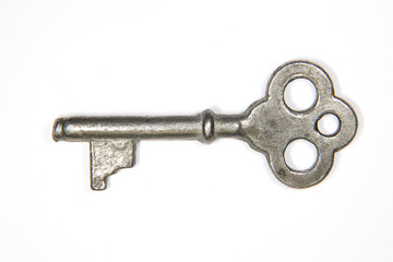 One old key to the safe on a white background