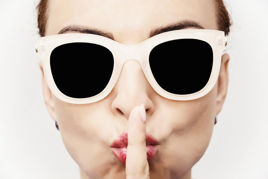Young caucasian glamour woman with stylish sunglasses and finger