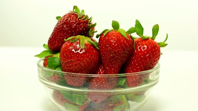 fruits - strawberries in bowl - white background studio