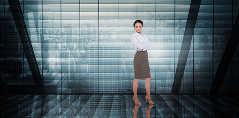 Fototapeta na wymiar Composite image of businesswoman with arms crossed