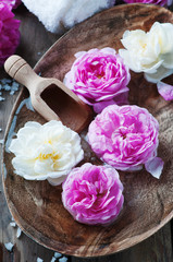 Concept of spa treatment with roses and salt