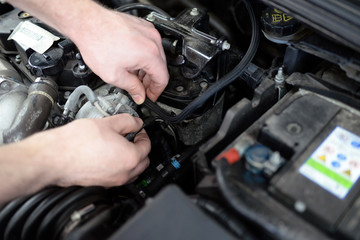 professional auto mechanic repaired in car workshop