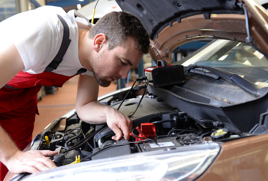 professional auto mechanic repaired in car workshop