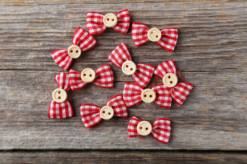 Sewing buttons on grey wooden background