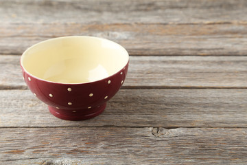 Empty bowl on grey wooden background