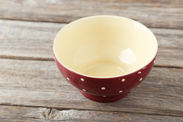 Empty bowl on grey wooden background
