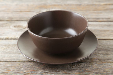 Empty bowl on grey wooden background