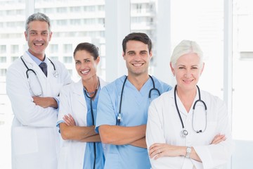 Fototapeta premium Portrait of confident doctors in row