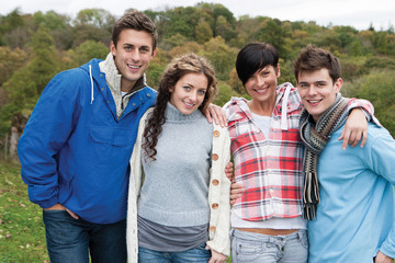 Two couples posing outdoors