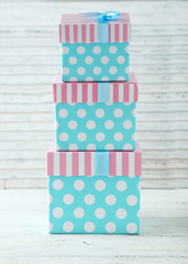 Beautiful gift boxes on white wooden background