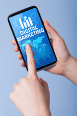 Man presses a touch screen smart phone with the symbol of an dig