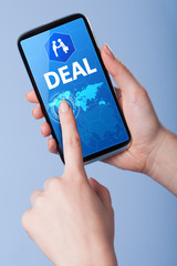 Man presses a touch screen smart phone with the symbol of an dea