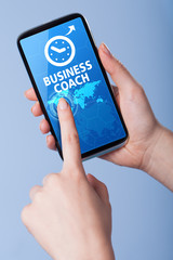 Man presses a touch screen smart phone with the symbol of   busi