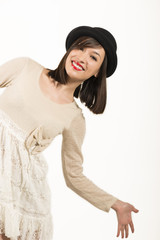 Portrait of a happy expressive girl with black hat