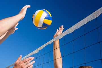 Friends playing volleyball - 83974721