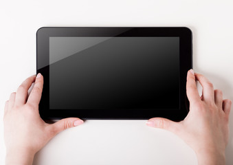 tablet pc with a blank screen in the hands. Business, technology