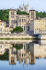 Fototapeta na wymiar Church and cathedral with reflection in soane in Lyon city
