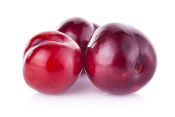 plums isolated on white